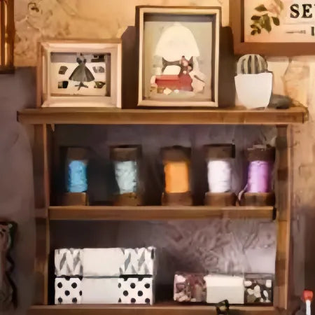 Close-up view of a decorative element in the Book Nook Kit - Lily Sewing Shop with fine details